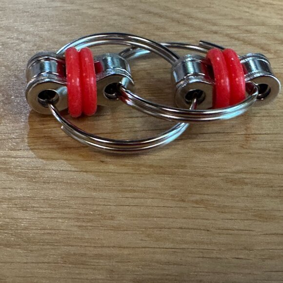 Fidget Toy: 4 Piece Flippy Roller Flick (Bike) Chain Fidget Toys with Case - Picture 12 of 16